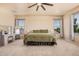 Bright main bedroom with a decorative vanity table and large windows, creating a relaxing atmosphere at 3016 W White Canyon Rd, San Tan Valley, AZ 85144