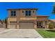 Charming two-story home featuring a three-car garage and well-manicured lawn at 3016 W White Canyon Rd, San Tan Valley, AZ 85144