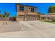 Two-story home with three-car garage and easy-care landscaping at 3016 W White Canyon Rd, San Tan Valley, AZ 85144