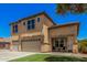Charming two-story home with a well-manicured front lawn at 3016 W White Canyon Rd, San Tan Valley, AZ 85144