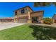 Charming two-story home with a well-manicured front lawn at 3016 W White Canyon Rd, San Tan Valley, AZ 85144