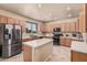 Well-lit kitchen with stainless steel appliances, ample counter space, and a convenient center island at 3016 W White Canyon Rd, San Tan Valley, AZ 85144