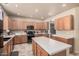 Large kitchen with abundant counter space, stainless appliances, and a central island for food preparation at 3016 W White Canyon Rd, San Tan Valley, AZ 85144