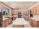 Spacious kitchen features stainless steel appliances, a center island, and plenty of cabinet storage at 3016 W White Canyon Rd, San Tan Valley, AZ 85144