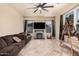 Comfortable living space with tile floors, fireplace, and natural light at 3016 W White Canyon Rd, San Tan Valley, AZ 85144
