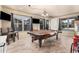 Spacious living space featuring a pool table and ample natural light at 3016 W White Canyon Rd, San Tan Valley, AZ 85144