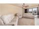 Spacious living room features neutral-colored walls, plush furniture, carpet and natural light at 3016 W White Canyon Rd, San Tan Valley, AZ 85144