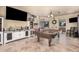Open-concept living space featuring tile floors, a bar, and a pool table at 3016 W White Canyon Rd, San Tan Valley, AZ 85144