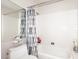 Bathroom showcasing a shower-tub combo with neutral accents at 3033 W Tierra Buena Ln, Phoenix, AZ 85053