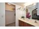 Bathroom showcasing a double sink vanity and a walk-in closet at 3033 W Tierra Buena Ln, Phoenix, AZ 85053