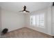 Bright bedroom with plantation shutters and a ceiling fan at 3033 W Tierra Buena Ln, Phoenix, AZ 85053
