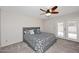 Bedroom featuring a ceiling fan and french doors leading outdoors at 3033 W Tierra Buena Ln, Phoenix, AZ 85053