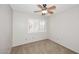 Bedroom features a modern ceiling fan and bright natural light at 3033 W Tierra Buena Ln, Phoenix, AZ 85053