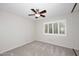 Bedroom features a modern ceiling fan and bright natural light at 3033 W Tierra Buena Ln, Phoenix, AZ 85053