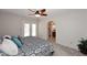 Bedroom featuring a ceiling fan and en-suite bathroom access at 3033 W Tierra Buena Ln, Phoenix, AZ 85053
