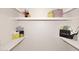 Bright closet space with shelves and decorative shopping bags at 3033 W Tierra Buena Ln, Phoenix, AZ 85053