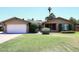 Charming single-story home featuring a well-manicured lawn and a classic brick exterior at 3033 W Tierra Buena Ln, Phoenix, AZ 85053