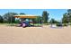 Neighborhood playground featuring swings, slides, and shade canopies providing a fun recreation area at 3033 W Tierra Buena Ln, Phoenix, AZ 85053
