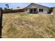 Spacious backyard featuring a covered patio with views of neighboring houses at 317 E Nunneley Rd, Gilbert, AZ 85296