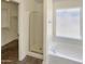 Bright bathroom showcasing a glass-enclosed shower and a tub under a window, providing a clean and functional space at 317 E Nunneley Rd, Gilbert, AZ 85296