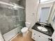 Updated bathroom featuring a granite-topped vanity and a glass-enclosed shower at 317 E Nunneley Rd, Gilbert, AZ 85296