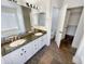 Updated bathroom with a double vanity, granite countertops, and slate floors at 317 E Nunneley Rd, Gilbert, AZ 85296