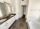 Bathroom with double sinks, a large mirror, and a separate shower and tub at 317 E Nunneley Rd, Gilbert, AZ 85296