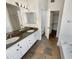 Bathroom with double sinks, a large mirror, and a separate shower and tub at 317 E Nunneley Rd, Gilbert, AZ 85296