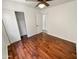 Spacious bedroom featuring wood flooring, a closet, and a ceiling fan at 317 E Nunneley Rd, Gilbert, AZ 85296