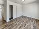 Inviting bedroom with wood floors, closet, and neutral paint scheme at 317 E Nunneley Rd, Gilbert, AZ 85296