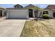 Charming single-story home with a well-maintained front yard and attached two-car garage at 317 E Nunneley Rd, Gilbert, AZ 85296