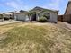 Charming home with a two-car garage and mature landscaping including palm trees at 317 E Nunneley Rd, Gilbert, AZ 85296