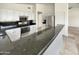 Open-concept kitchen featuring granite countertops, stainless steel appliances, and functional design for entertaining at 317 E Nunneley Rd, Gilbert, AZ 85296