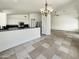 Inviting open-concept living area featuring a kitchen and dining room bathed in natural light, perfect for gathering at 317 E Nunneley Rd, Gilbert, AZ 85296