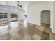 Open-concept living room boasting tile floors, high ceilings, and great natural light at 317 E Nunneley Rd, Gilbert, AZ 85296