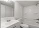 Clean, bright bathroom featuring a bathtub and shower with a single sink vanity at 320 E Mckellips Rd # 245, Mesa, AZ 85201