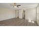Spacious primary bedroom with wood-look floors featuring an en suite closet and large window for natural light at 320 E Mckellips Rd # 245, Mesa, AZ 85201