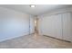 Bright bedroom features tile floors, a closet with sliding doors, and access to an ensuite bathroom at 3423 W Bloomfield Rd, Phoenix, AZ 85029