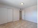 Bedroom featuring a large closet and tiled flooring at 3423 W Bloomfield Rd, Phoenix, AZ 85029