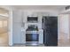 Updated kitchen with stainless steel appliances and ample counter space at 3423 W Bloomfield Rd, Phoenix, AZ 85029