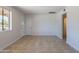 Bright living room showcasing neutral colors, tiled floor, and natural light at 3423 W Bloomfield Rd, Phoenix, AZ 85029
