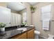 Well lit bathroom with a large sink, granite countertops, and ample storage at 3619 N 104Th Dr, Avondale, AZ 85392