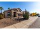 Charming single-Gathering home featuring stone accents, desert landscaping, and an attached two-car garage at 3619 N 104Th Dr, Avondale, AZ 85392