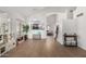 Open-concept living area with high ceilings, wood flooring, and seamless flow to other living areas at 3619 N 104Th Dr, Avondale, AZ 85392