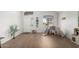 Bright, open-concept living space with high ceilings, wood flooring, and ample natural light at 3619 N 104Th Dr, Avondale, AZ 85392