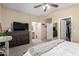 Spacious main bedroom with a view to the en-suite bathroom, walk in closet and king sized bed at 3619 N 104Th Dr, Avondale, AZ 85392