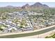Expansive aerial view showcasing the community, landscape, and proximity to local amenities at 4201 E Camelback Rd # 74, Phoenix, AZ 85018