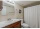 Clean bathroom featuring a modern vanity and a shower with a curtain at 4201 E Camelback Rd # 74, Phoenix, AZ 85018