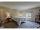 Bright bedroom with a large window, neutral walls, and plush carpeting at 4201 E Camelback Rd # 74, Phoenix, AZ 85018