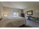 Comfortable bedroom features soft carpeting and a quaint reading nook at 4201 E Camelback Rd # 74, Phoenix, AZ 85018